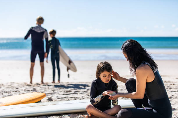 istock Aussie family on the beach getting ready for a surf 1335401339