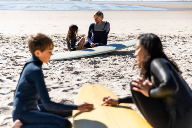 istock Aussie family on the beach getting ready for a surf 1335401421