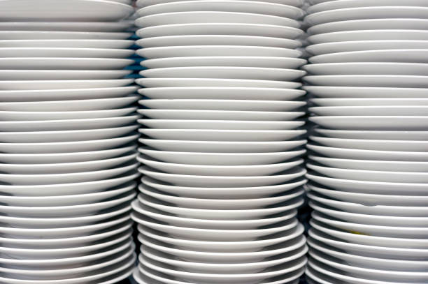 istock White porcelain plates, stacked on kitchen. 1335402175