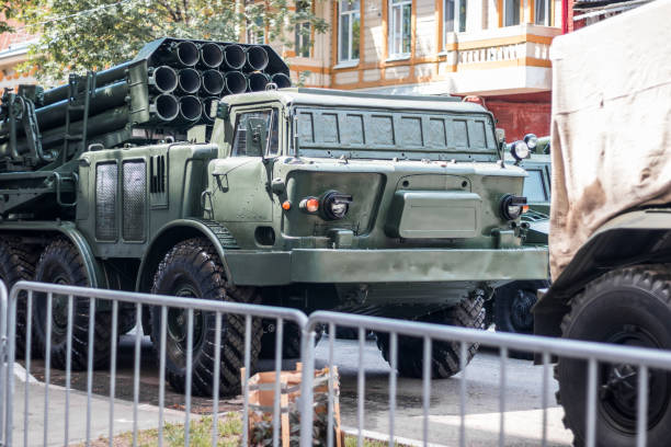 istock Military artillery , self-propelled multiple rocket launcher system on a city street 1335402394