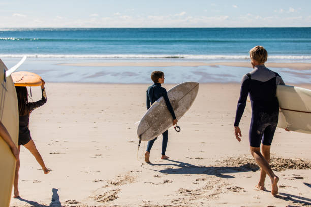 istock Aussie family heads into the water for a surf 1335402416