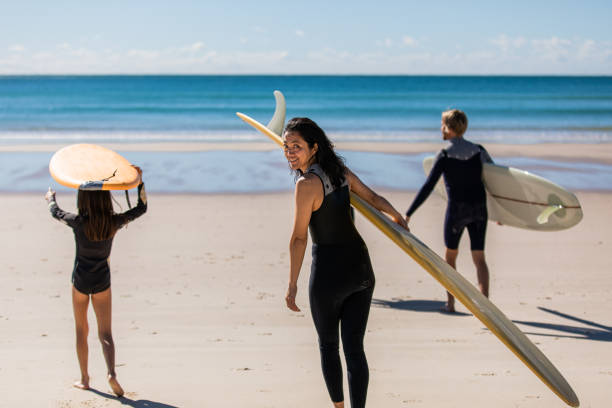 istock Aussie family heads into the water for a surf 1335402417