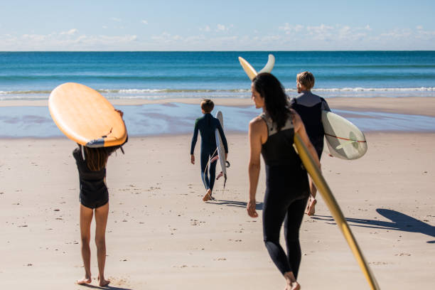 istock Aussie family heads into the water for a surf 1335402575