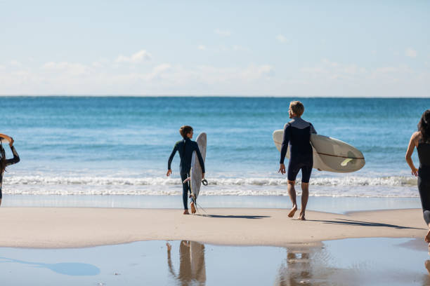 istock Aussie family heads into the water for a surf 1335402578