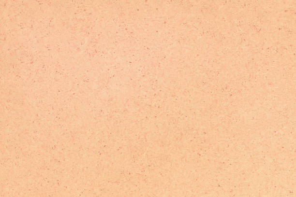 istock A sheet of hardboard covered with small dots, scratches and inclusions. 1335403333