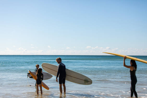 istock Aussie family heads into the water for a surf 1335403594