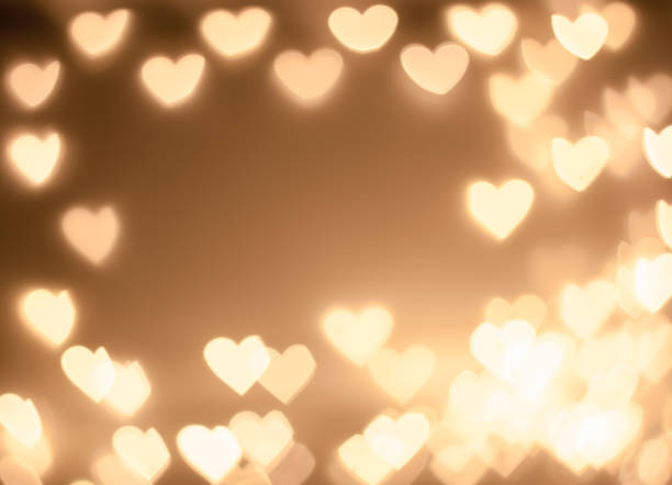istock Abstract love concept:bokeh sparkling light in beautiful golden light colors for design,web,text,Christmas,love,beautiful heart-shaped background 1335404682