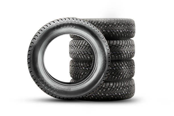 istock winter directional studded tires isolate, set stack on a white background 4 wheels, safety on ice 1335404915