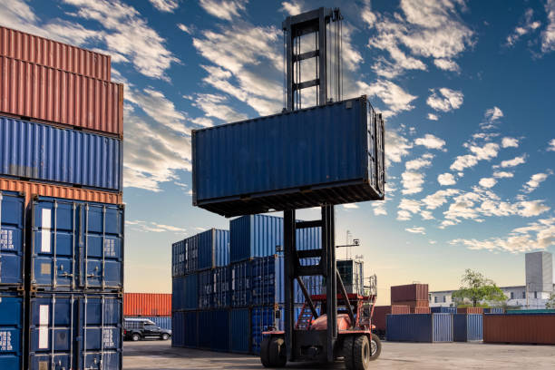 istock Forklift handling containers box at inside warehouse area business and industry heavy workers of goods and Transportation 1335404976