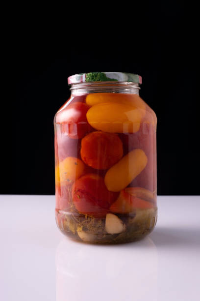 istock canned vegetables in a jar on a white table and black background 1335405008