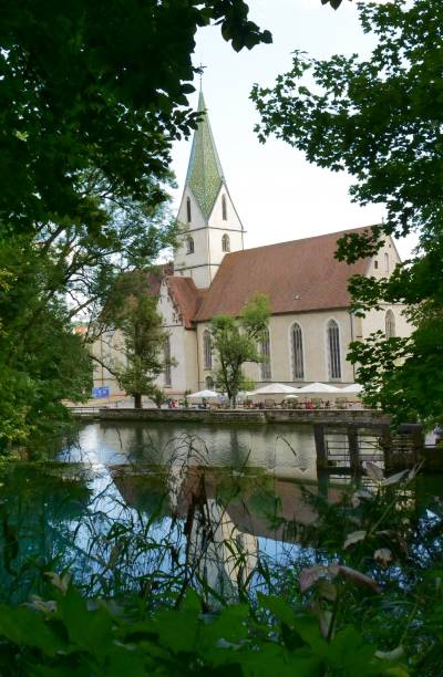 istock Old church reflected on the blue lake 1335405264