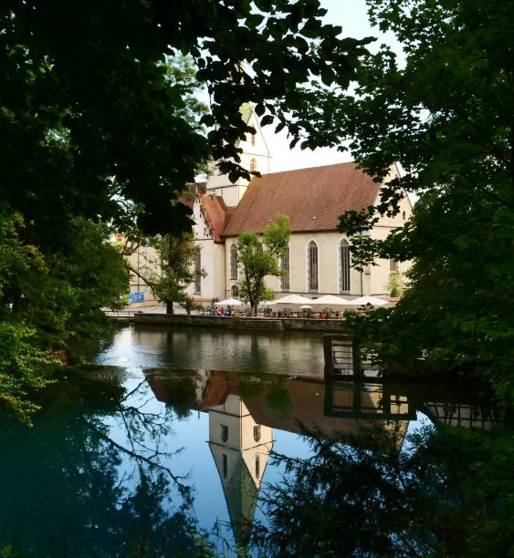 istock Reflected church on the blue lake 1335405785