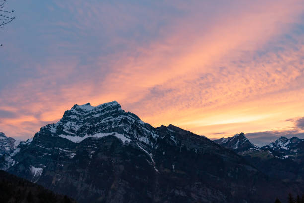 istock colorful sunset with mountains in swiss alps 1335406202