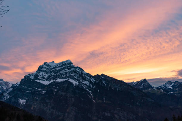 istock colorful sunset with mountains in swiss alps 1335406412