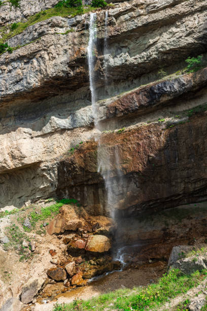 istock Beautiful high waterfall in the mountains 1335407542
