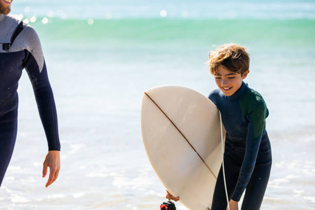 istock Father and son go surfing together 1335407748