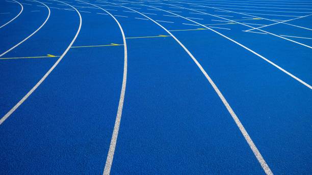 a running lane at the track and field of a sport competition - starting line sprinting track and field track event imagens e fotografias de stock