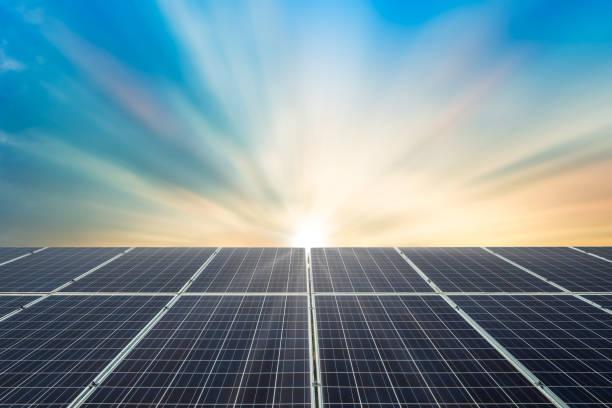 Solar panel cell on dramatic sunset sky background,clean Alternative power energy concept.