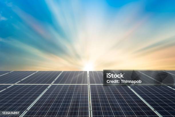 Solar Panel Cell On Dramatic Sunset Sky Backgroundclean Alternative Power Energy Concept Stock Photo - Download Image Now