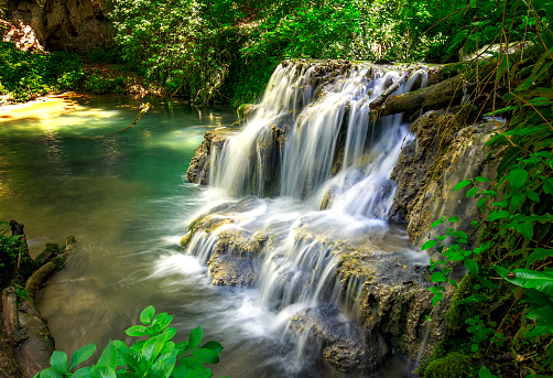 Waterfall in nature. Mountain cascade river waterfall.