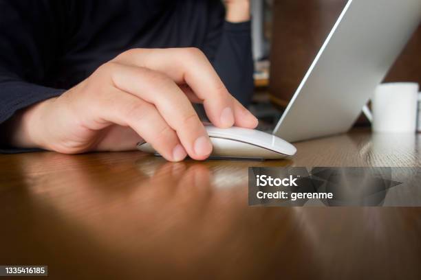 Clicking Mouse Stock Photo - Download Image Now - Computer Mouse, Laptop, Hand