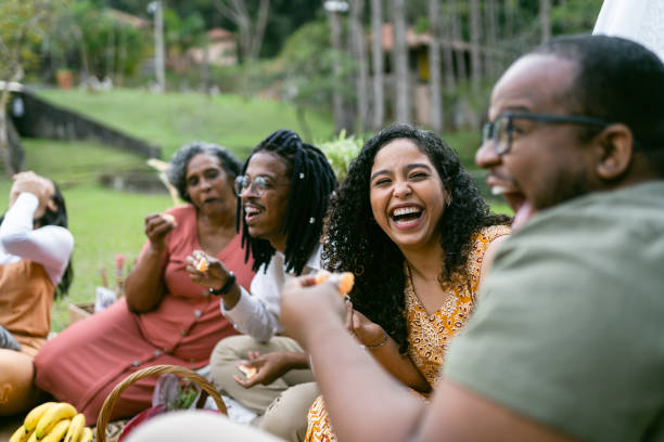 Smiling friends at the picnic Smiling friends at the picnic pick nick stock pictures, royalty-free photos & images