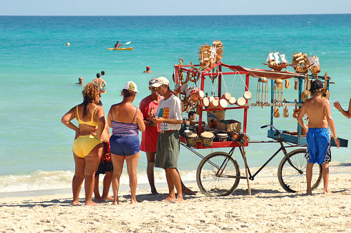 Cuba. August 09, 2019. Varadero: tourists shopping at a traveling beach stall in Varadero, Cuba