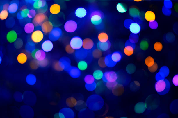 istock Abstract blue and colorful bokeh texture on black background 1335421944