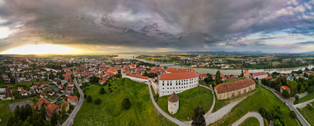 Panoramic View at Ptuj Town, Ptuj Castle and Drava River in Slovenia stock photo