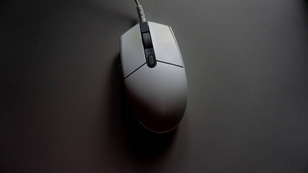 istock white RGB led gaming mouse on the table. 1335424437