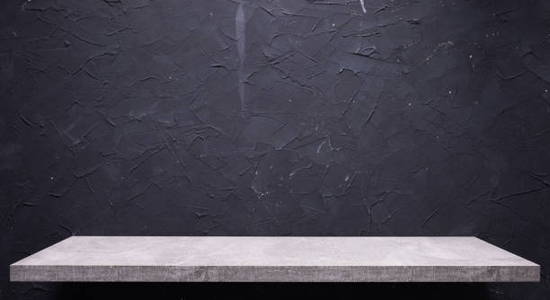 istock Abstract black stone background texture and shelf at wall. Book shelf at wall 1335425902