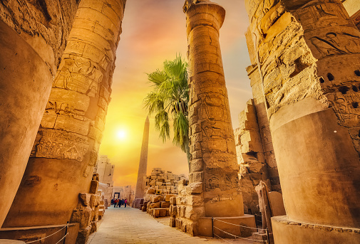 Luxor Karnak temple. The pylon with blue sky and pyramids