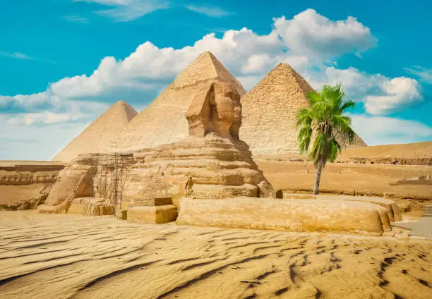 Sphinx and pyramid in the egyptian desert