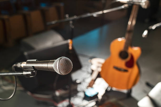 istock electric wired microphone on an empty stage without musicians. musical equipment for performing 1335426529