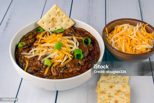 Chili Top With Cheese And Green Onions Stock Photo - Download Image Now - Chili Con Carne, Chili Pepper, Beef