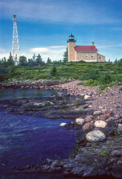 istock Keweenaw Peninsula Michigan - Copper Harbor Lighthouse & Shoreline Vertical - 2005 1335432881