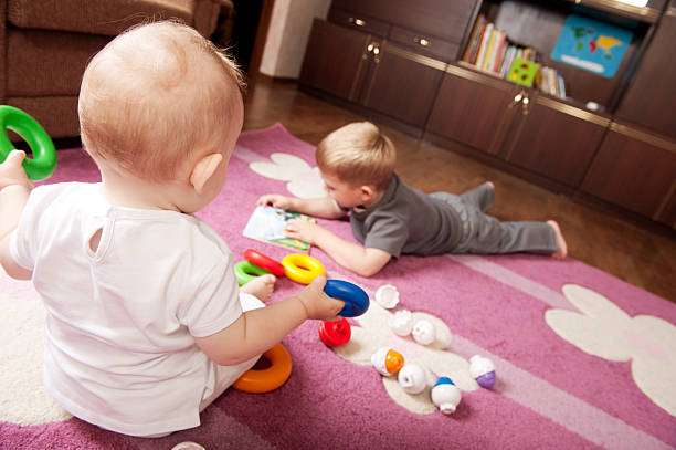 istock Brother and sister playing 133543435