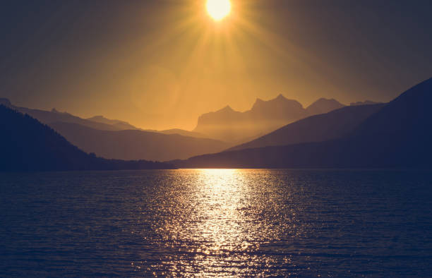 Scenic Northern Norway Nordland County Sunset with Ocean Bay and Mountains Range. Summer Time in the Nordland Wilderness.