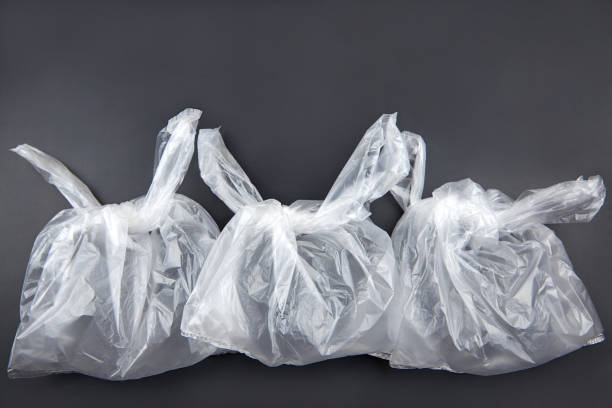 istock Plastic bags on dark background, environmental pollution concept. 1335436116