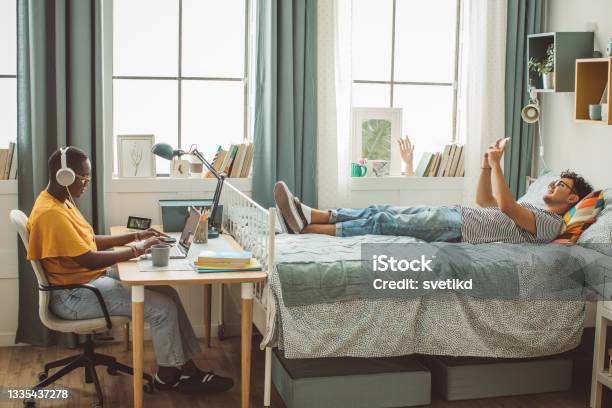 Friends At College Dorm Room Stock Photo - Download Image Now - College Dorm, Dorm Room, Domestic Room