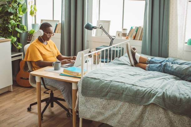 istock Friends at college dorm room 1335437305