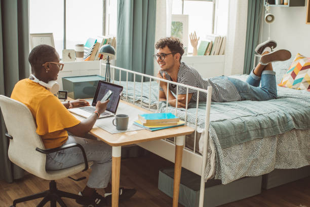 istock Friends at college dorm room 1335437312