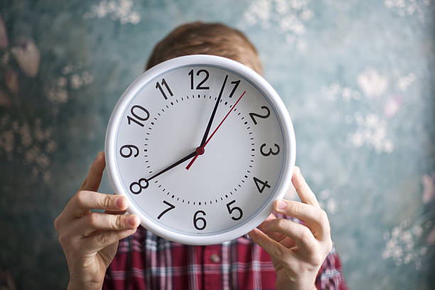 istock Unrecognizable Person Holding a Clock 133543950