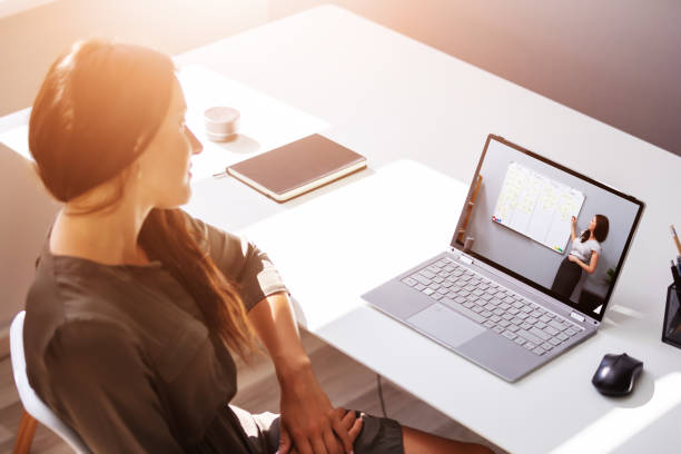 istock Woman Participating In Online Coaching Session 1335440097