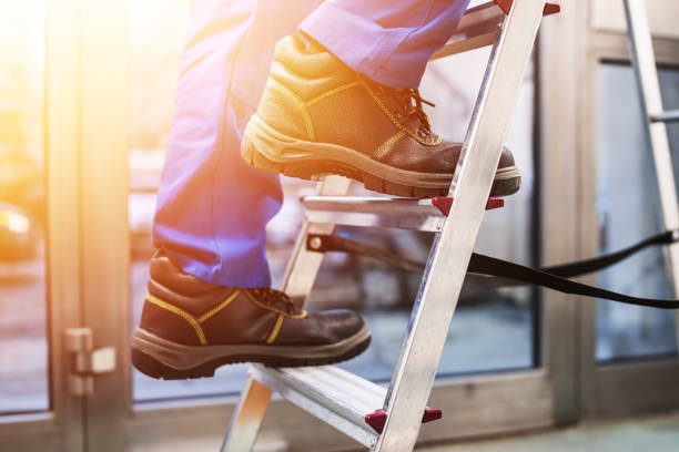 istock Handyman Climbing Ladder 1335440115