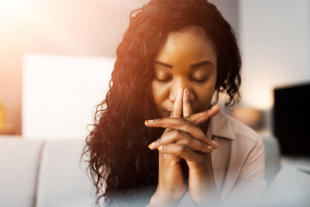 istock African American Woman Praying 1335440124