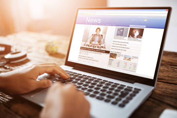 istock Businessman Reading News On Laptop 1335440129