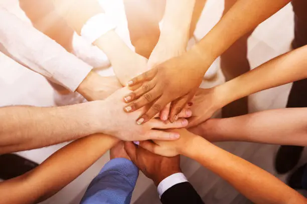 High Angle View Of Multiracial Friend Stacking Hand Together