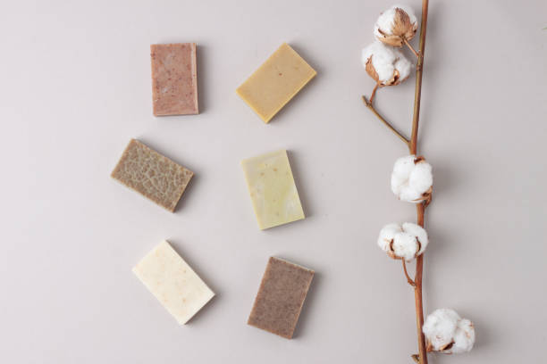 istock Soap with flowers on pastel grey background. Flat lay, copy space. 1335442021