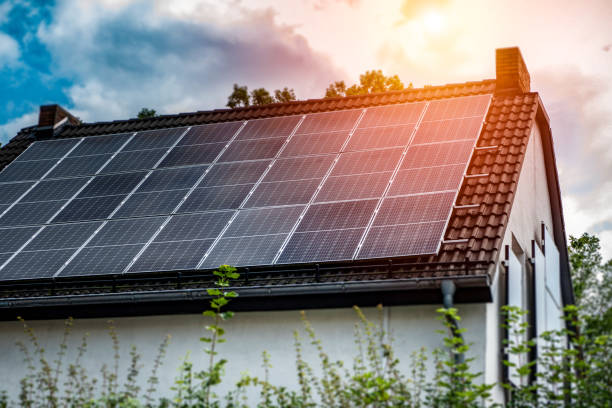 istock Old family house with large solar panel on the roof 1335443124